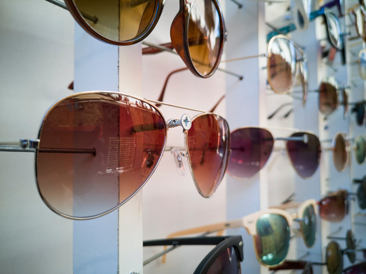 A vibrant display of sunglasses with various styles epitomizing modern eyewear fashion.